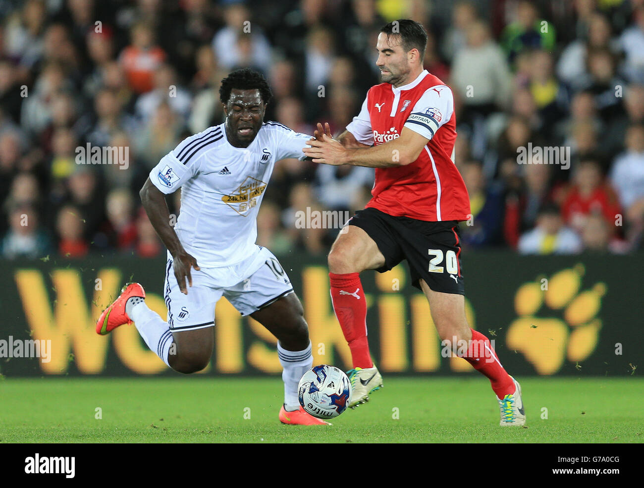 Rotherham United's Craig Morgan challenges Swansea City's Wilfried Bony ...