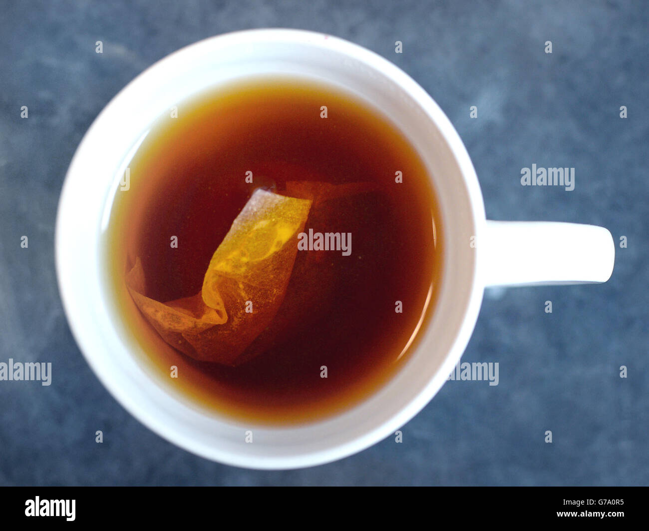 Lifestyle, Cup of Tea, London. A teabag brews in a cup of hot water, London. Stock Photo