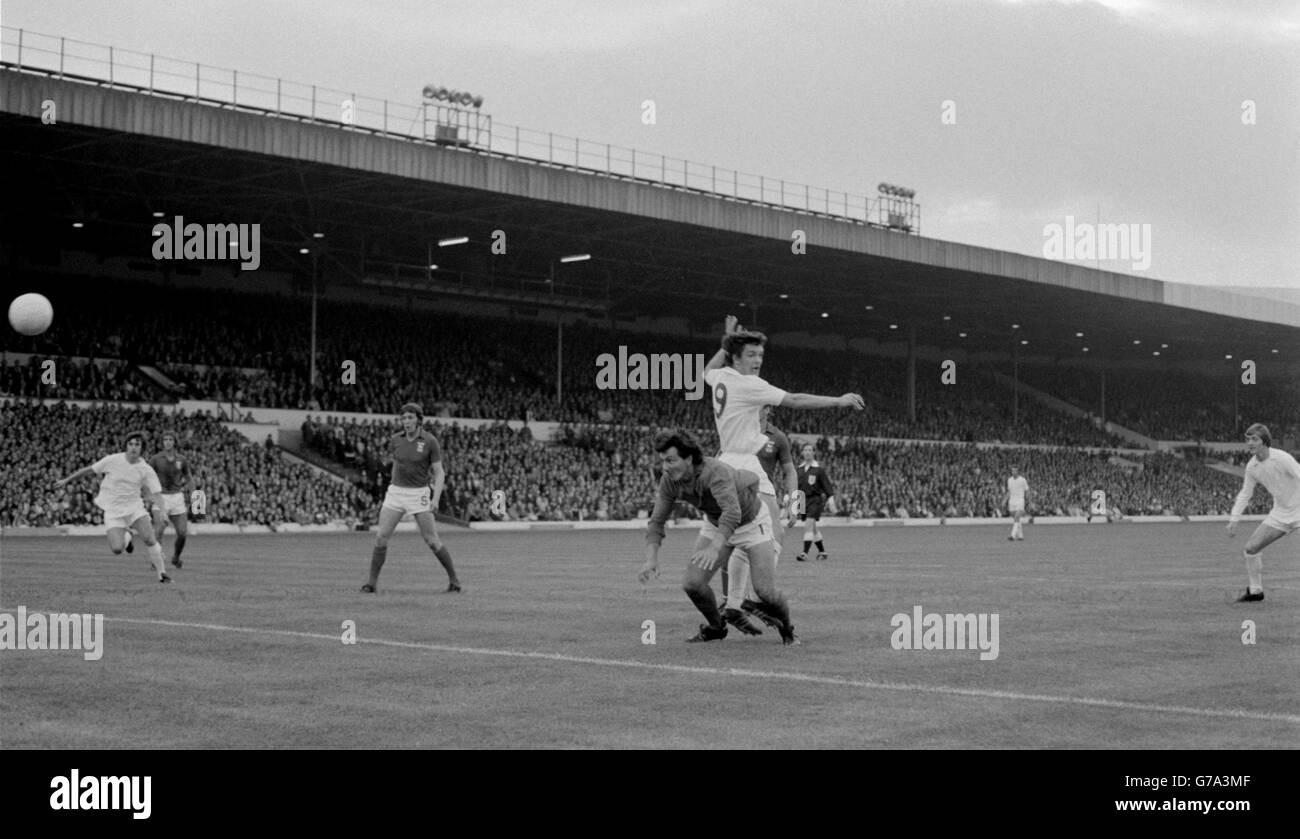 Leeds first goal is headed over Ipswich Town goalkeeper David Best (extreme right) by Leeds centre forward Joe Jordan (no 9) at Elland Road. Best was knocked out by the collision. Stock Photo
