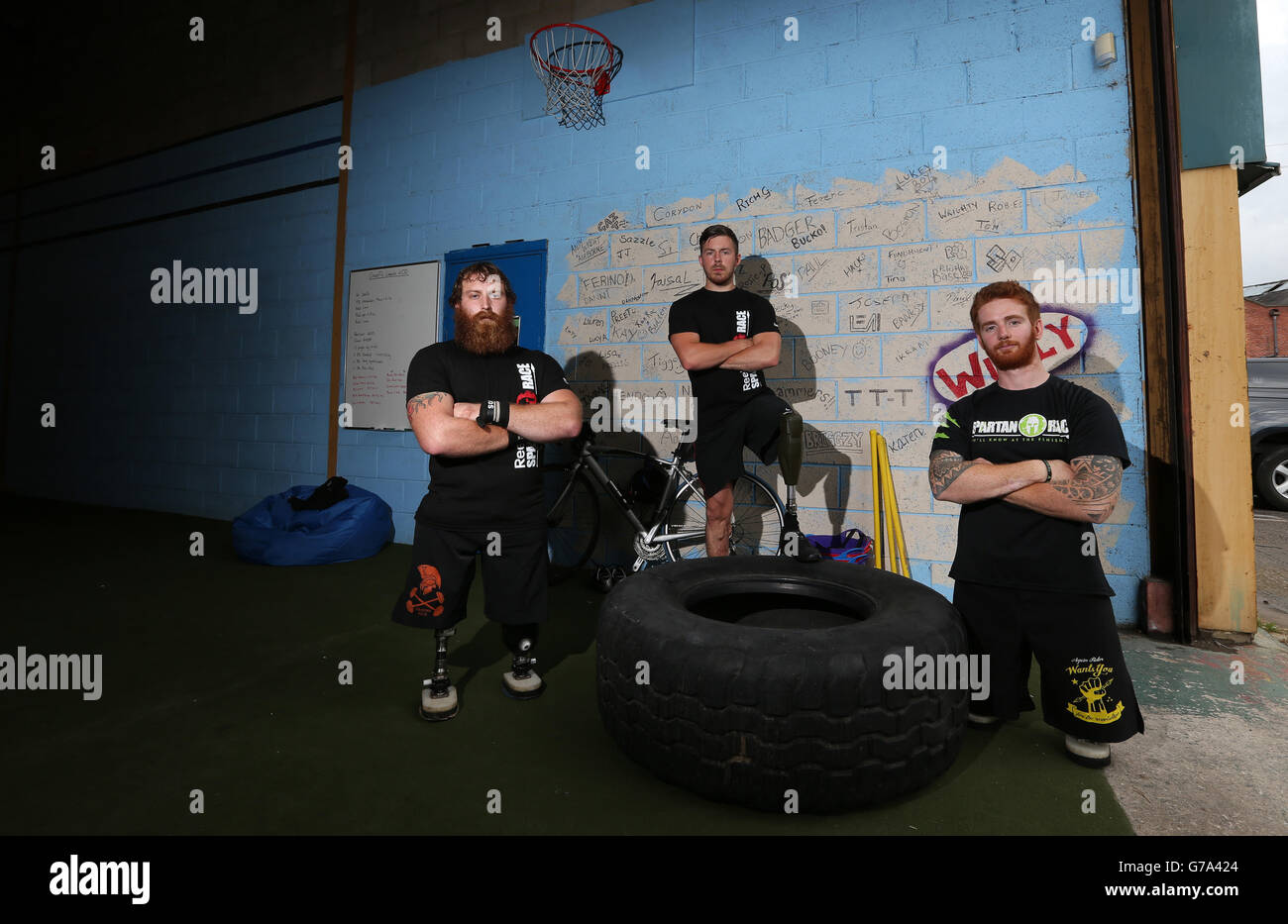 Left to right. Stevie Richardson, Jake Bartlett and James Simpson train at CrossFit, Leeds, ahead of taking part in the Spartan Race event. Stock Photo