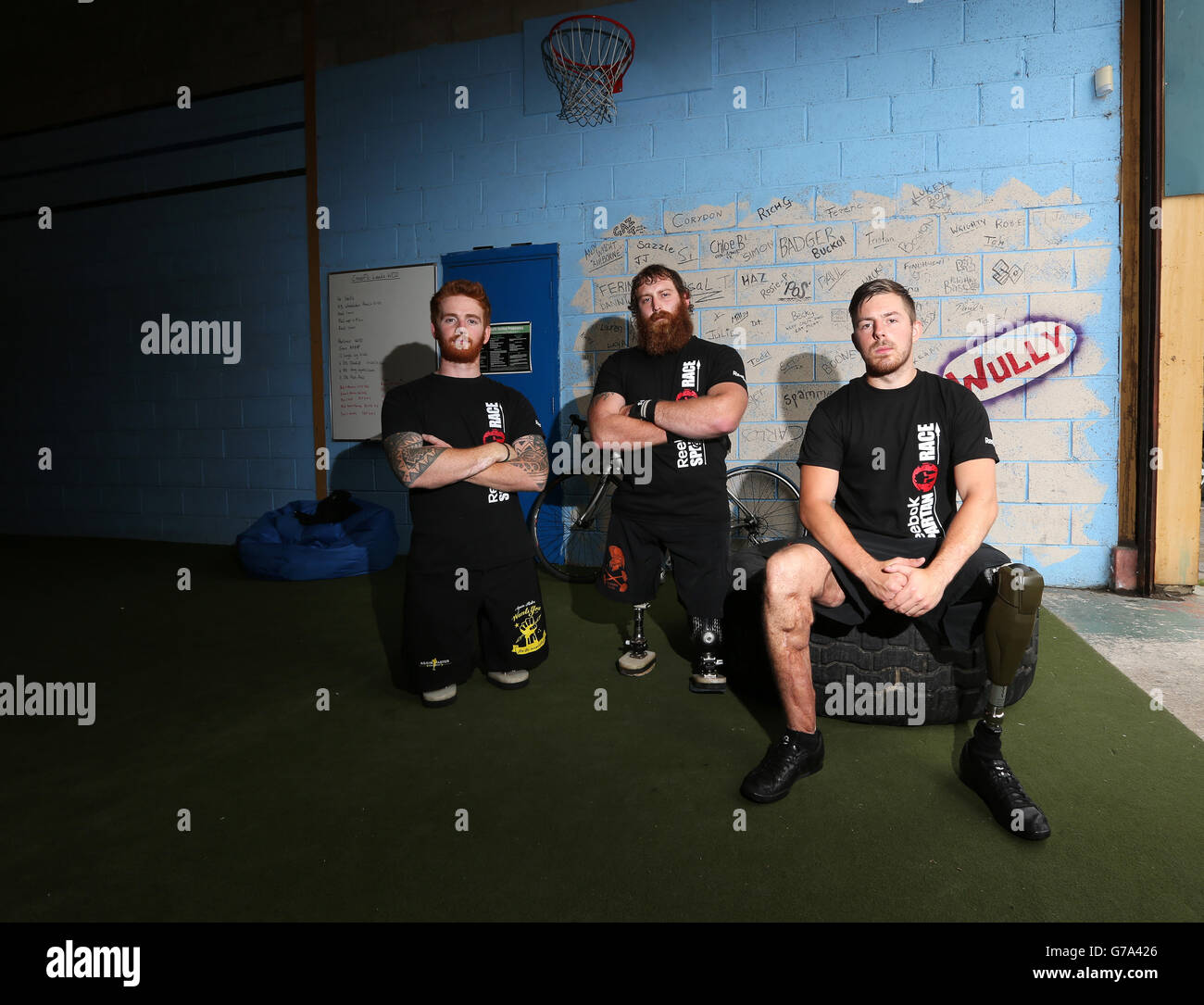 Left to right. James Simpson, Stevie Richardson and Jake Bartlett training at CrossFit, Leeds, ahead of taking part in the Spartan Race event. Stock Photo