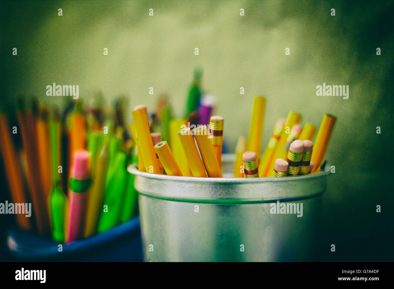 Photograph of some pencils colors and markers in plastic bottles Stock