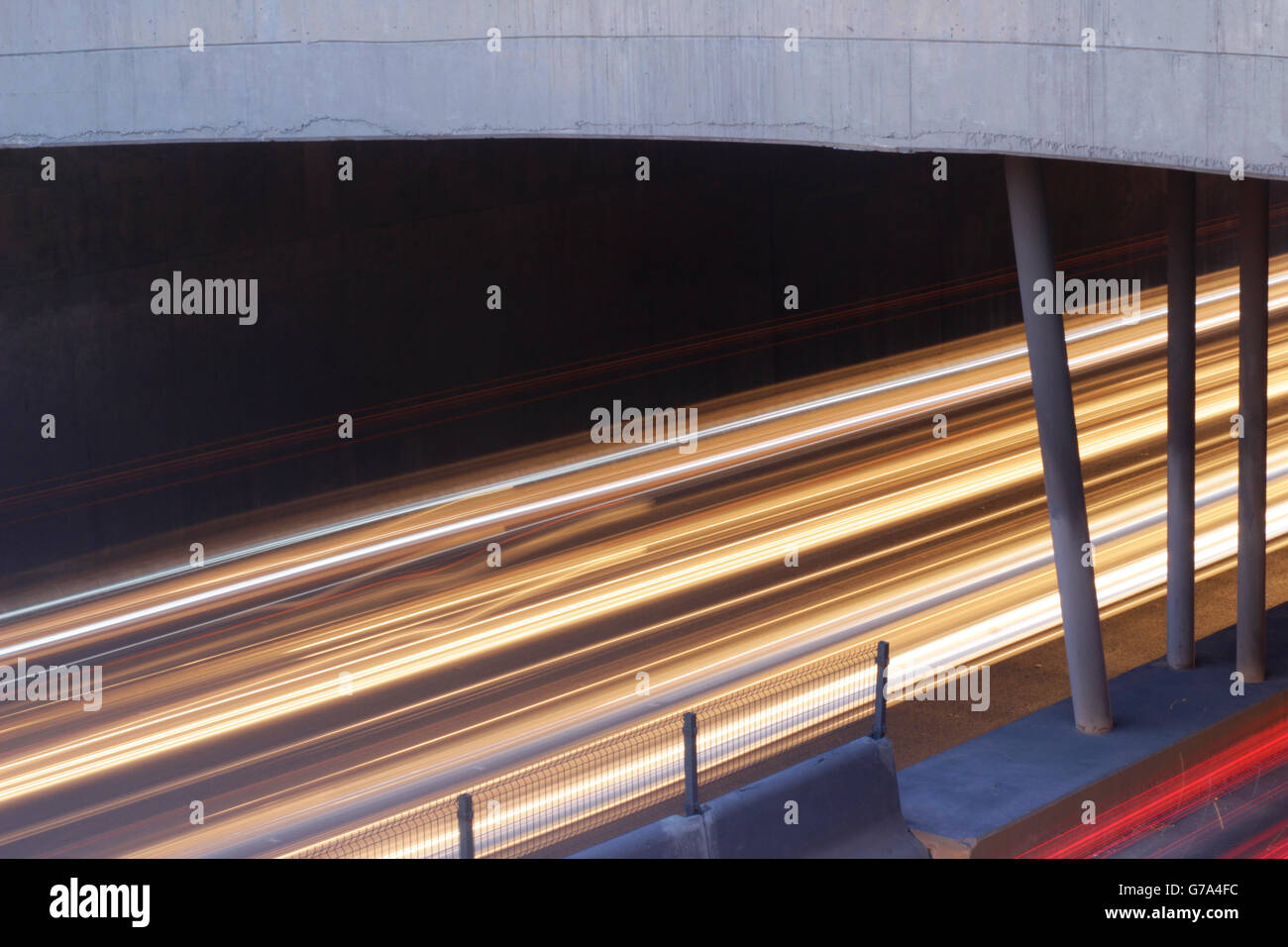 Photograph of blurred car lights on an urban scene with a long exposure effect Stock Photo