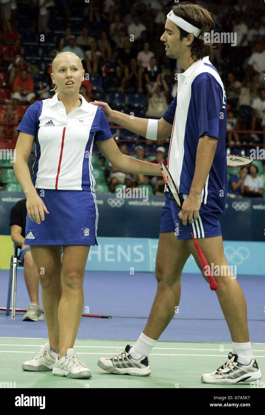 British badminton Silver Medal winners Nathan Robertson and Gail Emms react following their Gold Medal Mixed Doubles match at the Goudi Olympic Hall in Athens, Greece. Emms and Robertson lost to China's Jun Zhang and Ling Gao 1-15 15-12 12-15. Stock Photo