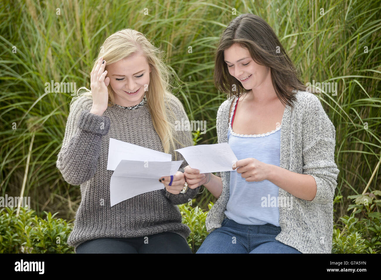 Students Holly Crouch (left) and Sarah Iles check their exam results at