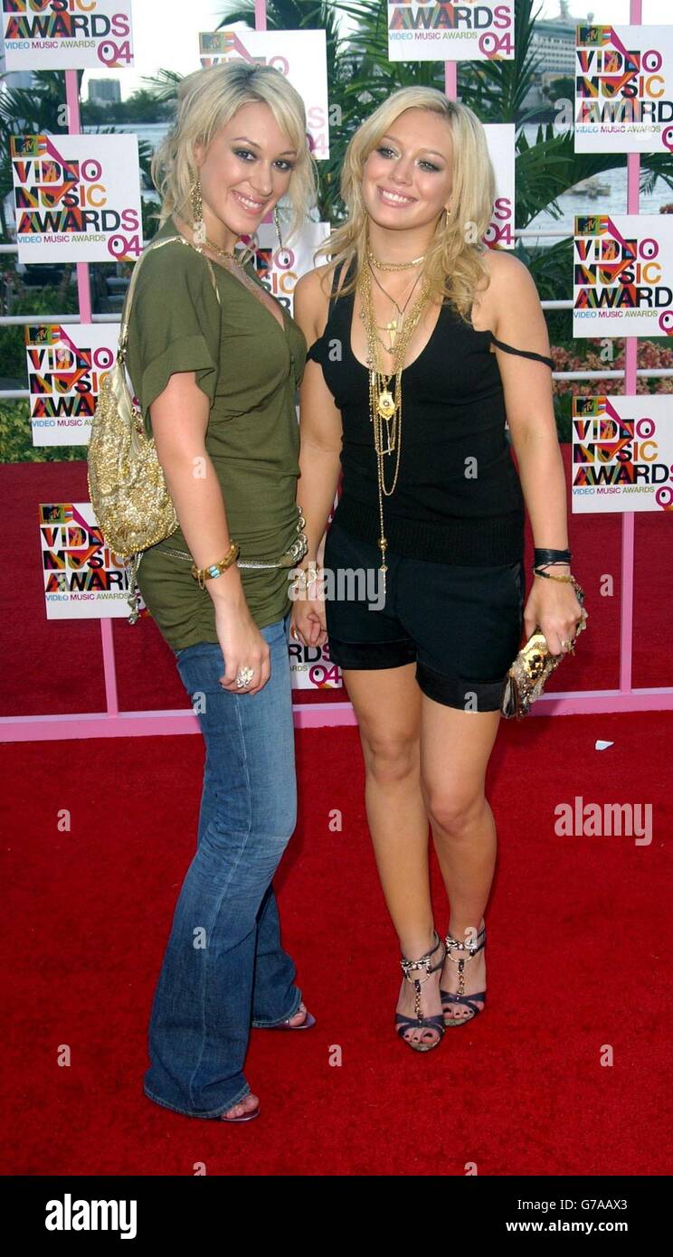 Hilary Duff (left) and sister Hayliearrive for the MTV Video Music Awards at the American Airlines Arena in Miami, Florida, United States. Stock Photo