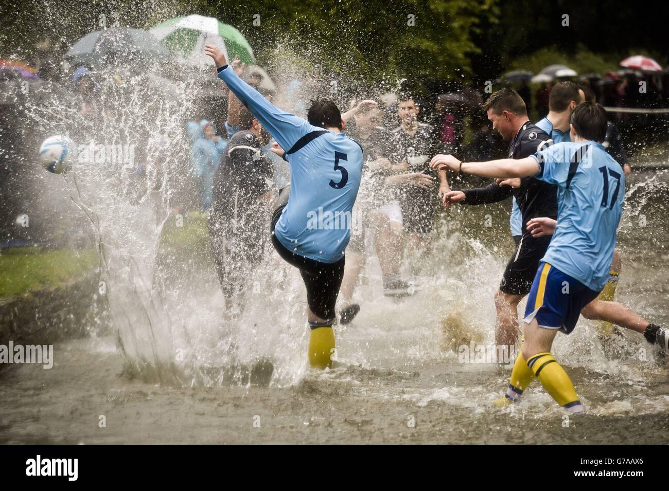 The ball heads out of in a huge spash of water as Bourton Rovers 1st