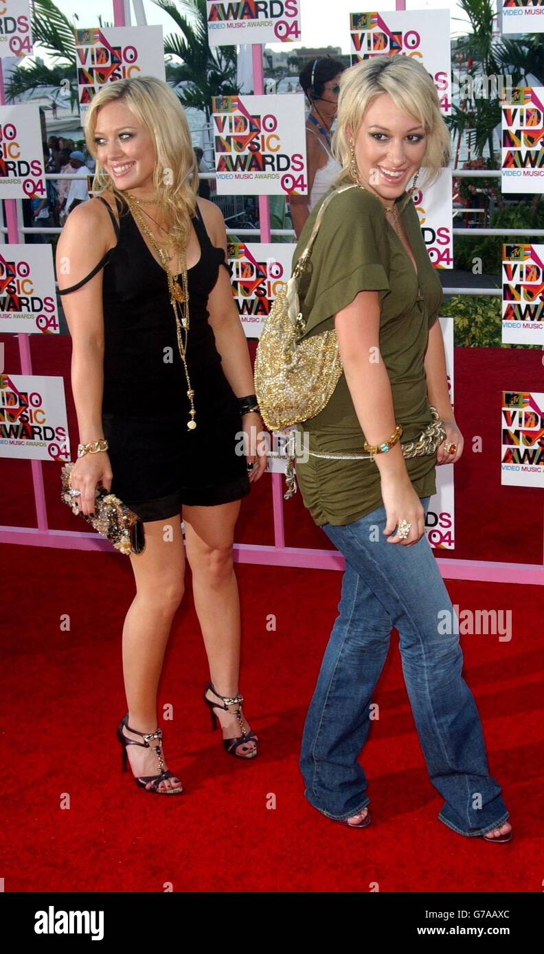Hilary Duff (left) and sister Hayliearrive for the MTV Video Music Awards at the American Airlines Arena in Miami, Florida, United States. Stock Photo