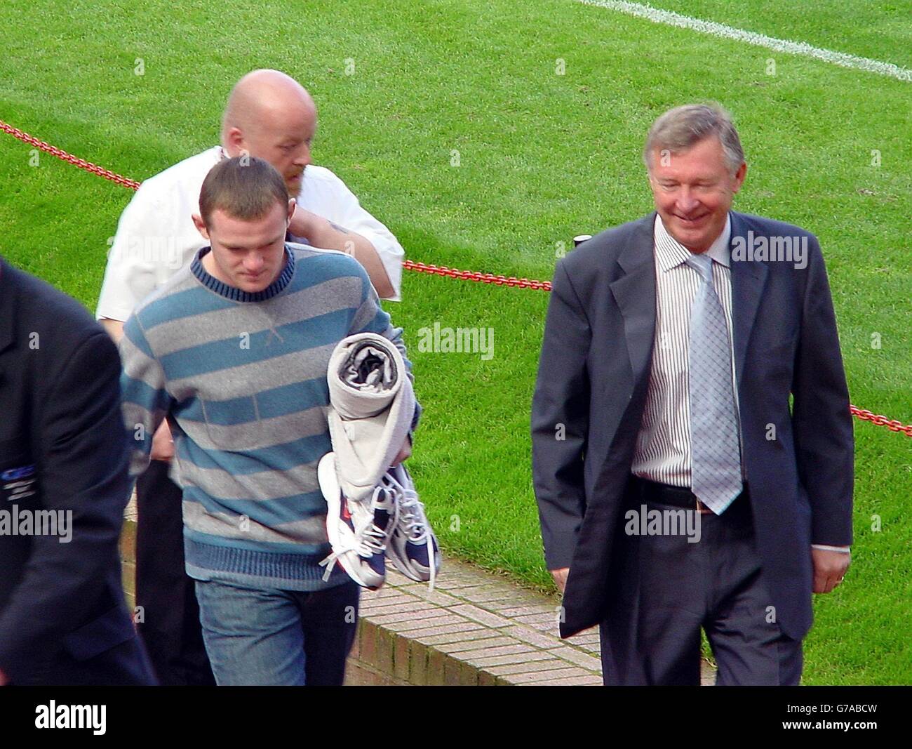 Manchester United's new signing Wayne Rooney (left) with manager Sir Alex Ferguson (right) at Old Trafford, Manchester. Stock Photo