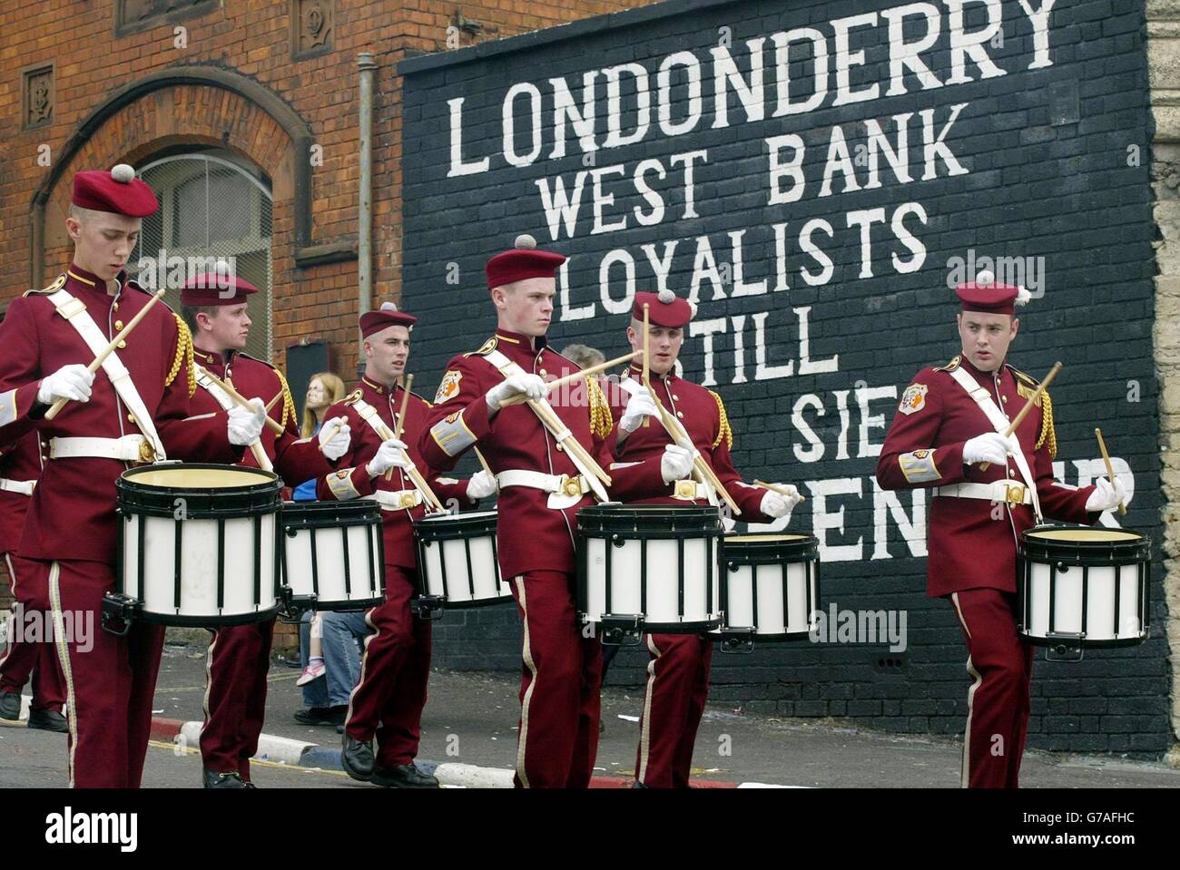 Some of the thousands of bandsmen taking part in the main Apprentice Boys parade in Londonderry. The annual parade marks the raising of the siege of Londonderry in 1689. About 15,000 Apprentice Boys took part in the demonstration, which began when several hundred members accompanied by three bands paraded along the city's historic walls. Stock Photo