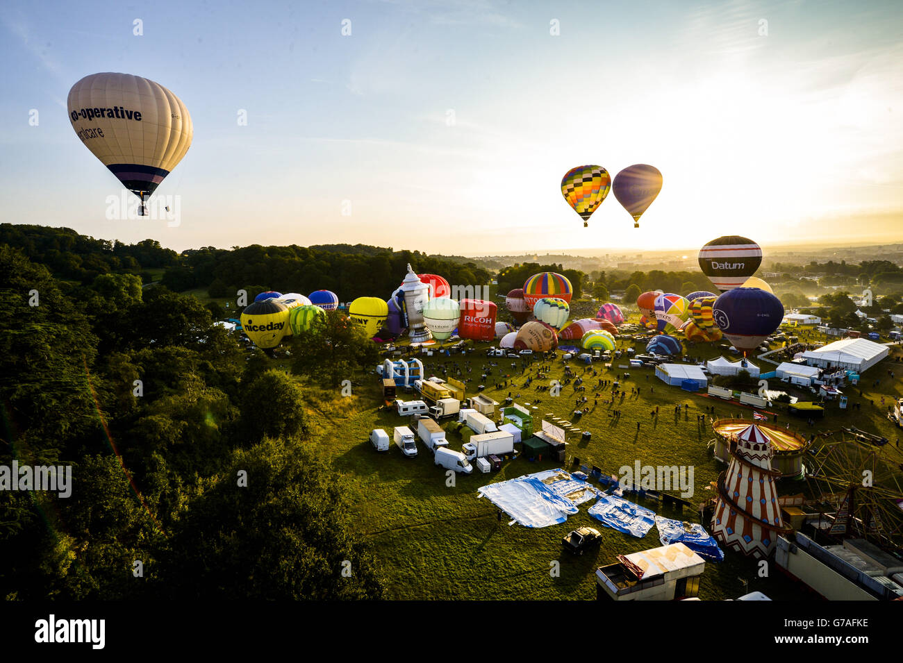 Hot air balloons lift off during a mass ascent at the 36th International Balloon Fiesta at the Ashton Court Estate near Bristol, which is Europe's largest ballooning event. Stock Photo