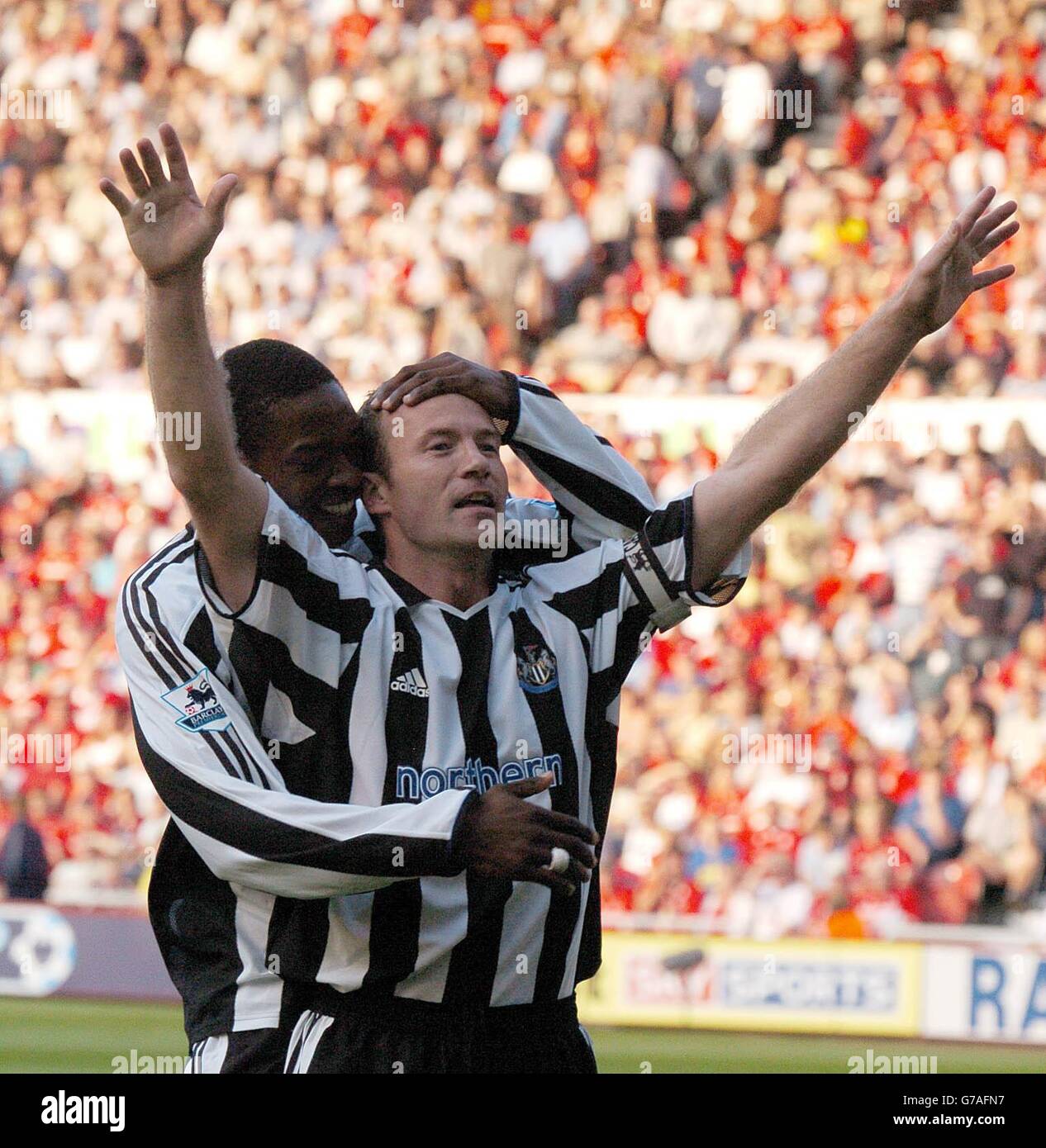 Newcastle United striker Alan Shearer celebrates with a team mate after ...