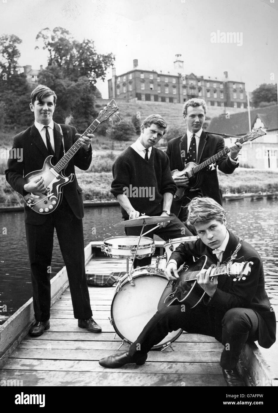 A band made up of pupils from Shrewsbury School practice on the River Severn. In addition to events at their school, they have also performed for local old-age pensioners. They are Richard J Willing-Denton (lead guitar), Charles Haselwood (drums), Giles Halfhead (guitar) and Mike Hewetson (bass guitar). Stock Photo