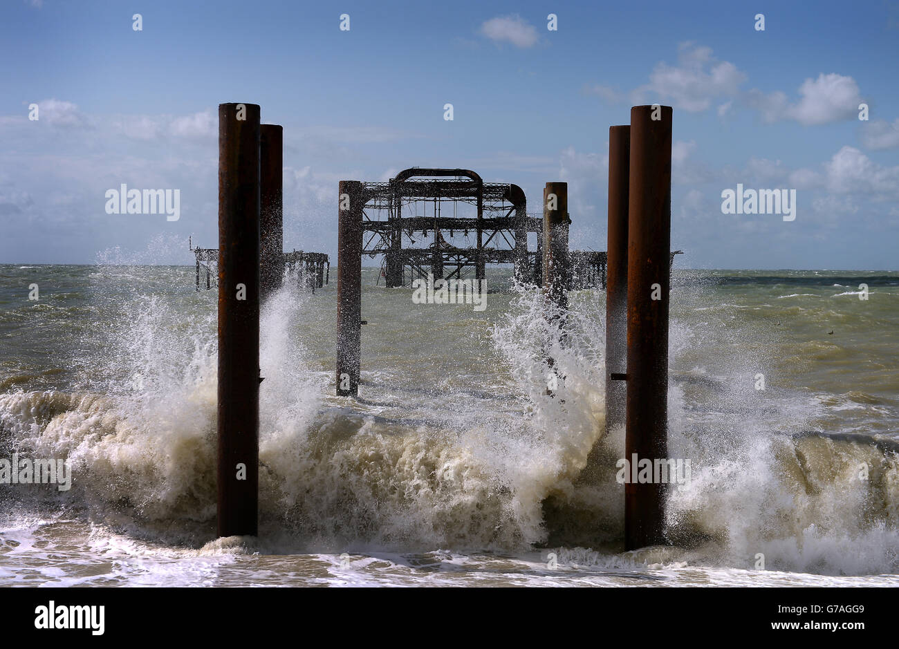 Waves crash on Brighton beach in front of the West pier as the effects of ex-Hurricane Bertha are felt across England and Wales. Stock Photo