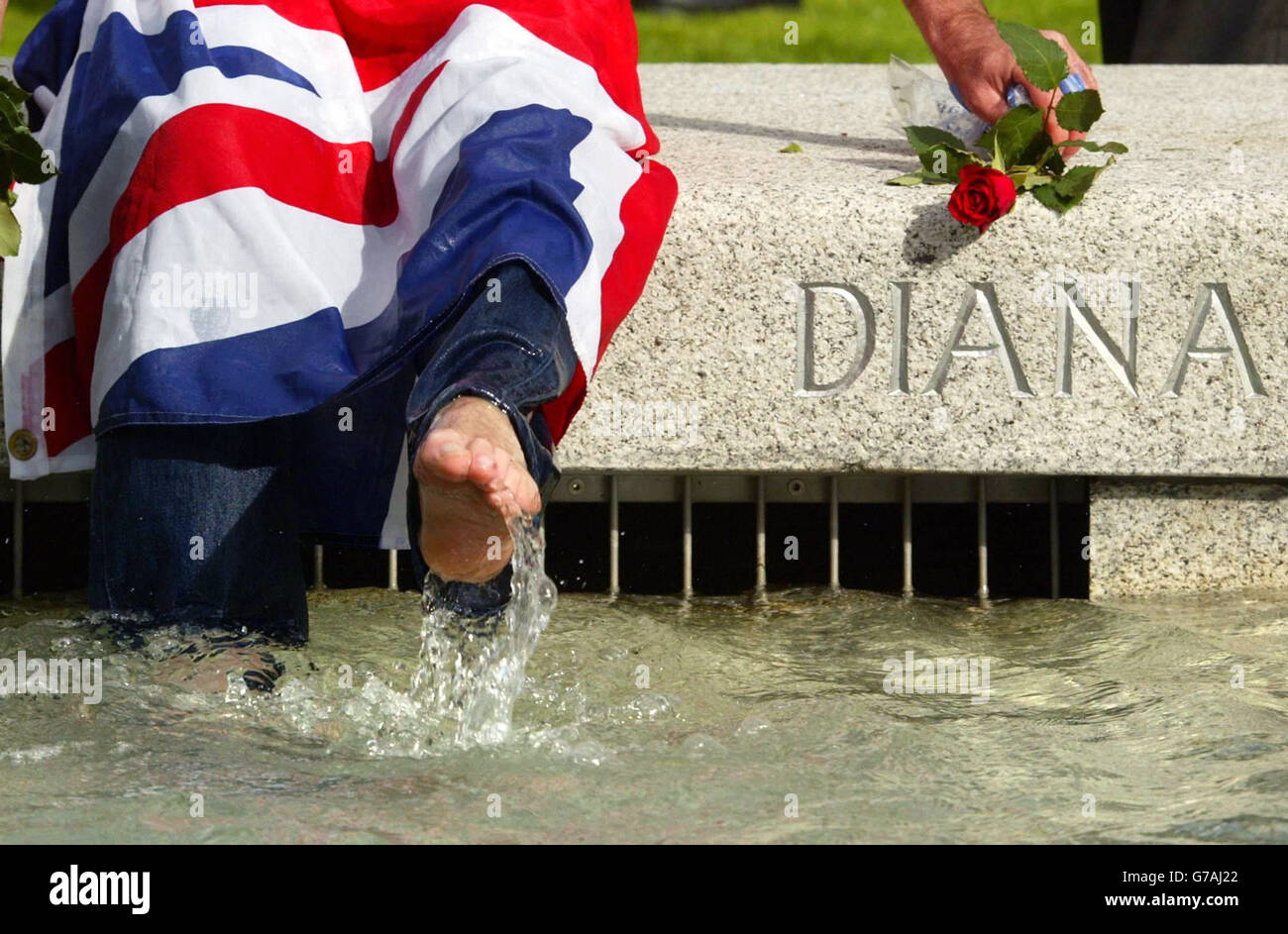 John Loughrey from Wandsworth,London, splashes around in the Diana Fountain as it reopens to the public after safety modifications. Stock Photo