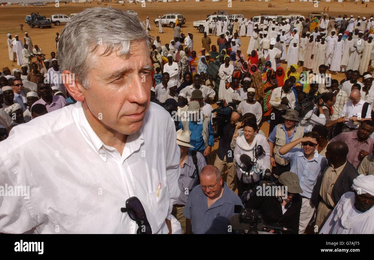 Foreign Secretary Jack Straw meets refugees in a feeding centre at the Abu Shouk camp near El Fasher in the Darfur region of northern Sudan. The camp - described by one British official as the 'Hilton' of the Darfur camps - is home to around 57,000 people forced to flee their villages following a campaign of violence by the Arab militias known as the Janjaweed. Mr Straw warned the Sudanese government that it must do more to protect refugees fleeing the violence in Darfur after seeing for himself the conditions in which they are living. Stock Photo