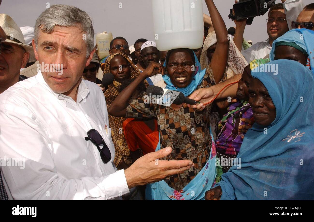 Foreign Secretary Jack Straw meets refugees in a feeding centre at the Abu Shouk camp near El Fasher in the Darfur region of northern Sudan. The camp - described by one British official as the "Hilton" of the Darfur camps - is home to around 57,000 people forced to flee their villages following a campaign of violence by the Arab militias known as the Janjaweed. Mr Straw warned the Sudanese government that it must do more to protect refugees fleeing the violence in Darfur after seeing for himself the conditions in which they are living. Stock Photo