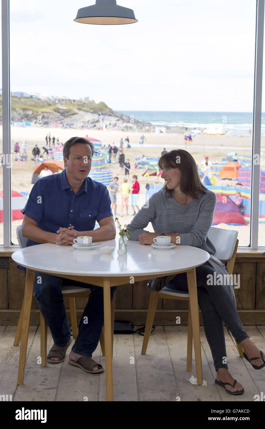 Prime Minister David Cameron and his wife Samantha at Surfside cafe on Polzeath beach, Wadebridge, as he has insisted he remains in control and will be able to manage the Government's response to the situation in Iraq from Cornwall, where he has headed for a break with his family. Stock Photo