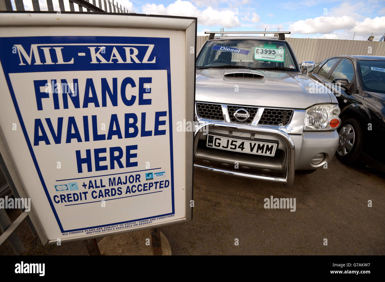 General view of signage at Mil Karz used car sales in Aveley, Essex