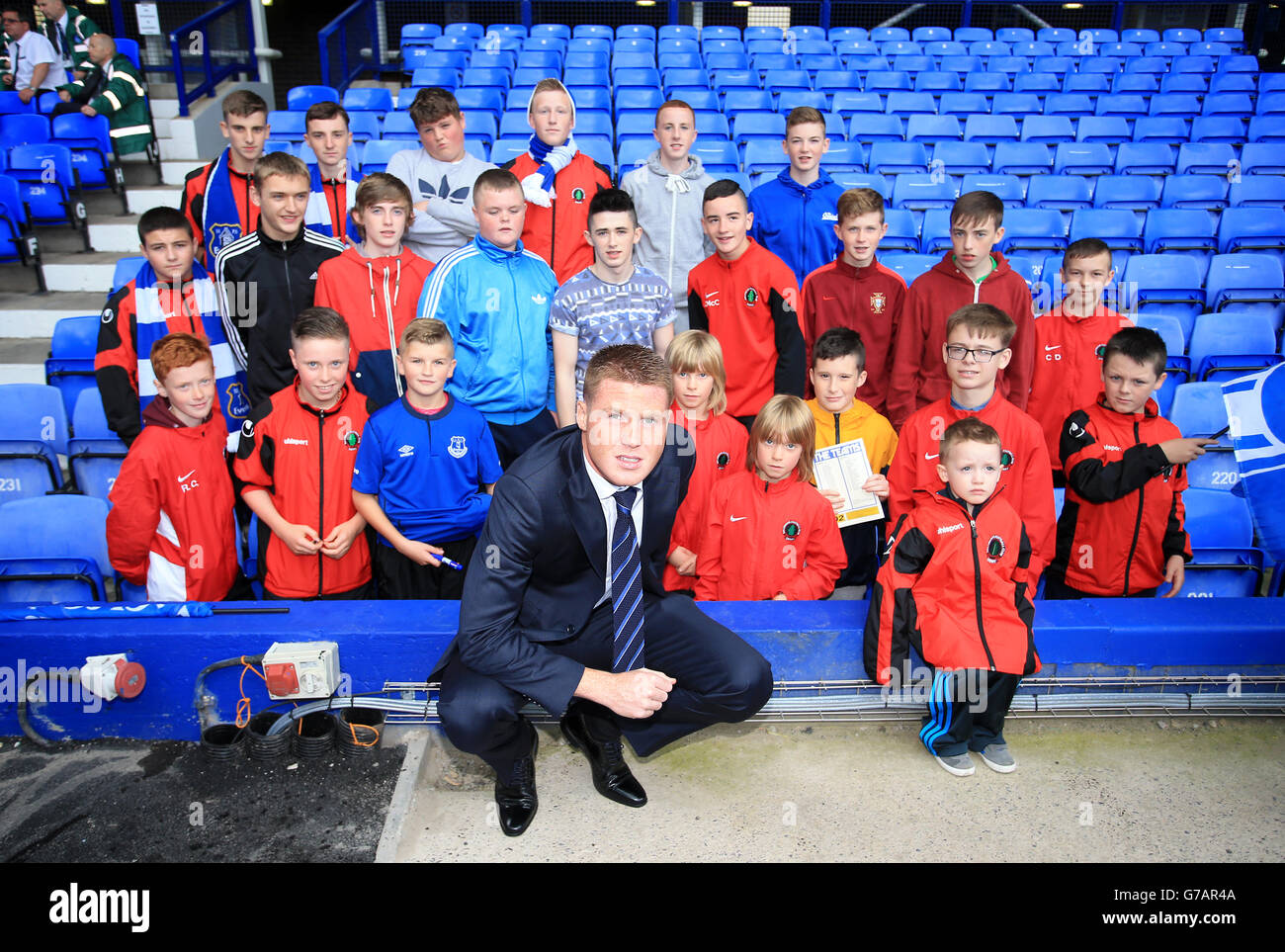 Everton's James McCarthy with members of Ballymoor FC before the Barclays  Premier League match at Goodison Park, Liverpool. PRESS ASSOCIATION Photo.  Picture date: Saturday August 30, 2014. See PA story SOCCER Everton.