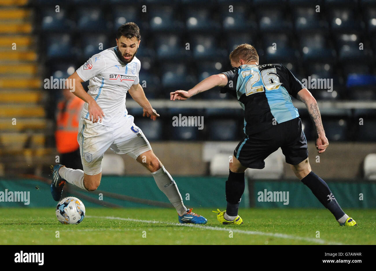 Wanderers Alfie Mawson (right) and Coventry City's Josh McQuoid