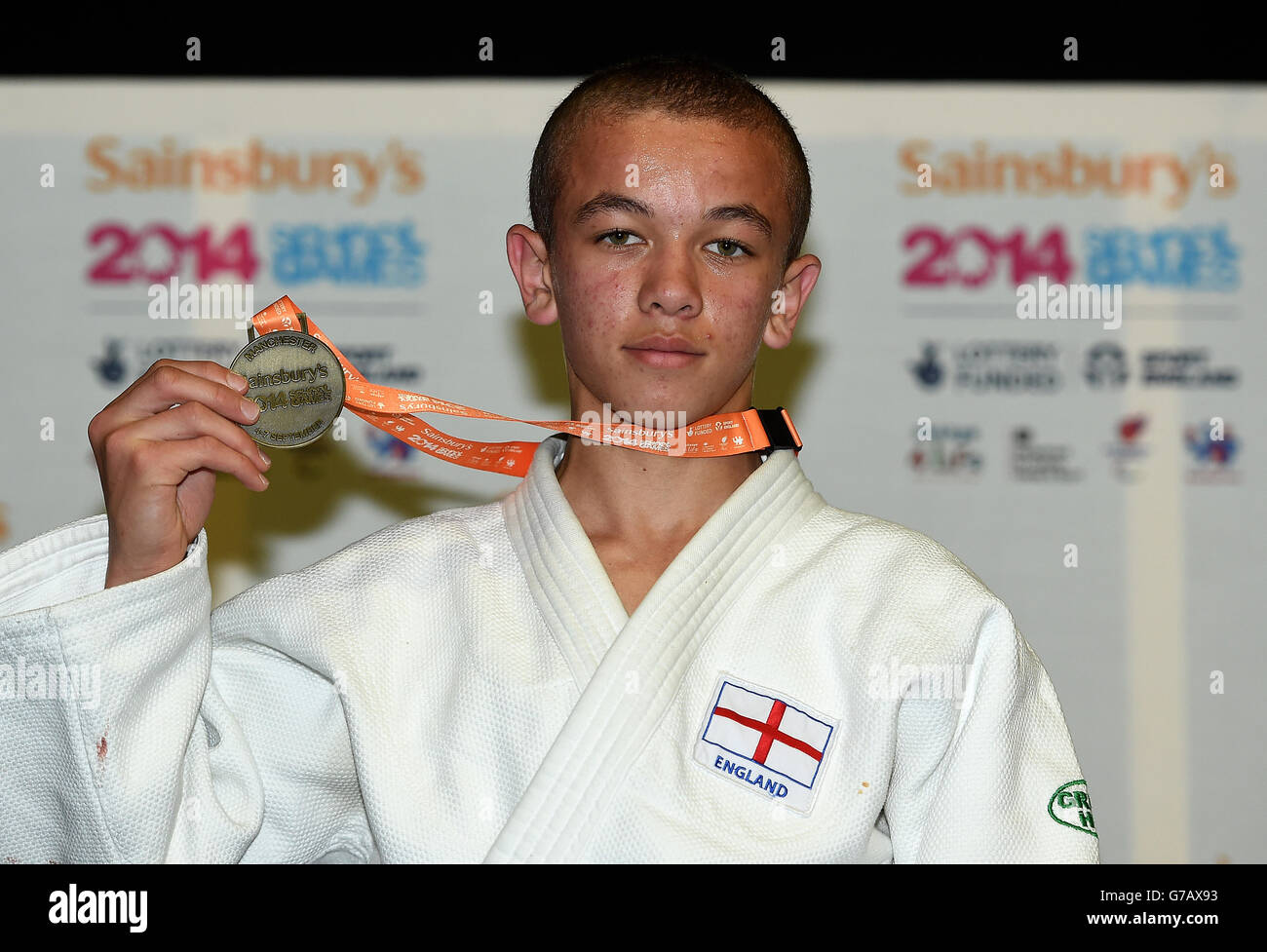 Sainsbury's 2014 School Games - 5th September 2014: Joshua Giles with his gold medal after winning the boys Under 50kg final during the Sainsbury's 2014 School Games at the Amaechi Centre, Manchester. Stock Photo