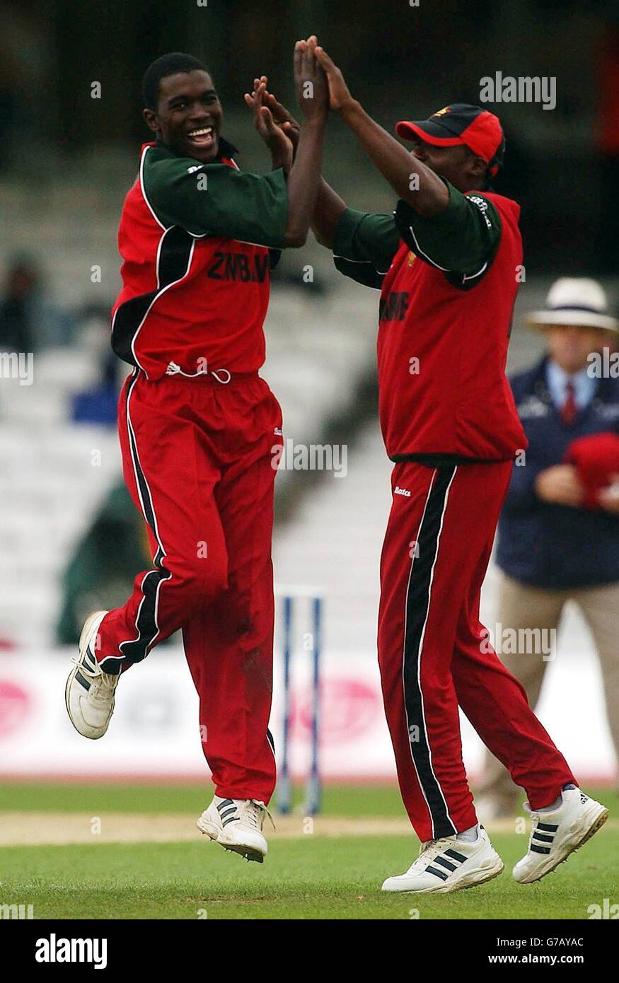 EDITORIAL USE ONLY. NO MOBILE PHONE USE. Elton Chigumbura (left) celebrates taking Marvan Atapattu's, wicket with Vusi Sibanda during the ICC Champions Trophy match between Sri Lanka and Zimbabwe, at the Oval, London. Stock Photo