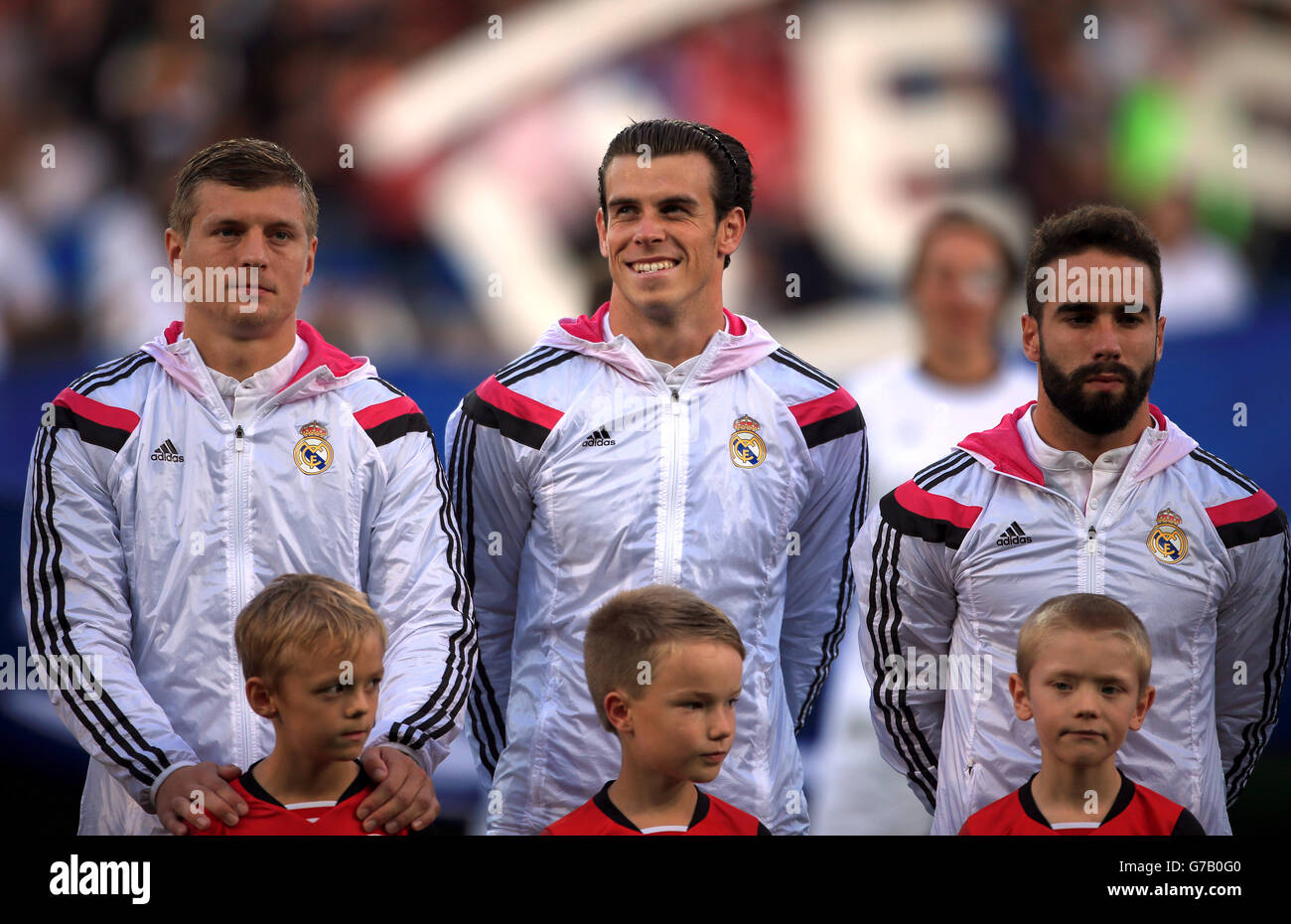 (L-R) Real Madrid's Toni Kroos, Gareth Bale and Daniel Carvajal line up before the UEFA Super Cup Final at the Cardiff City Stadium, Cardiff. Stock Photo