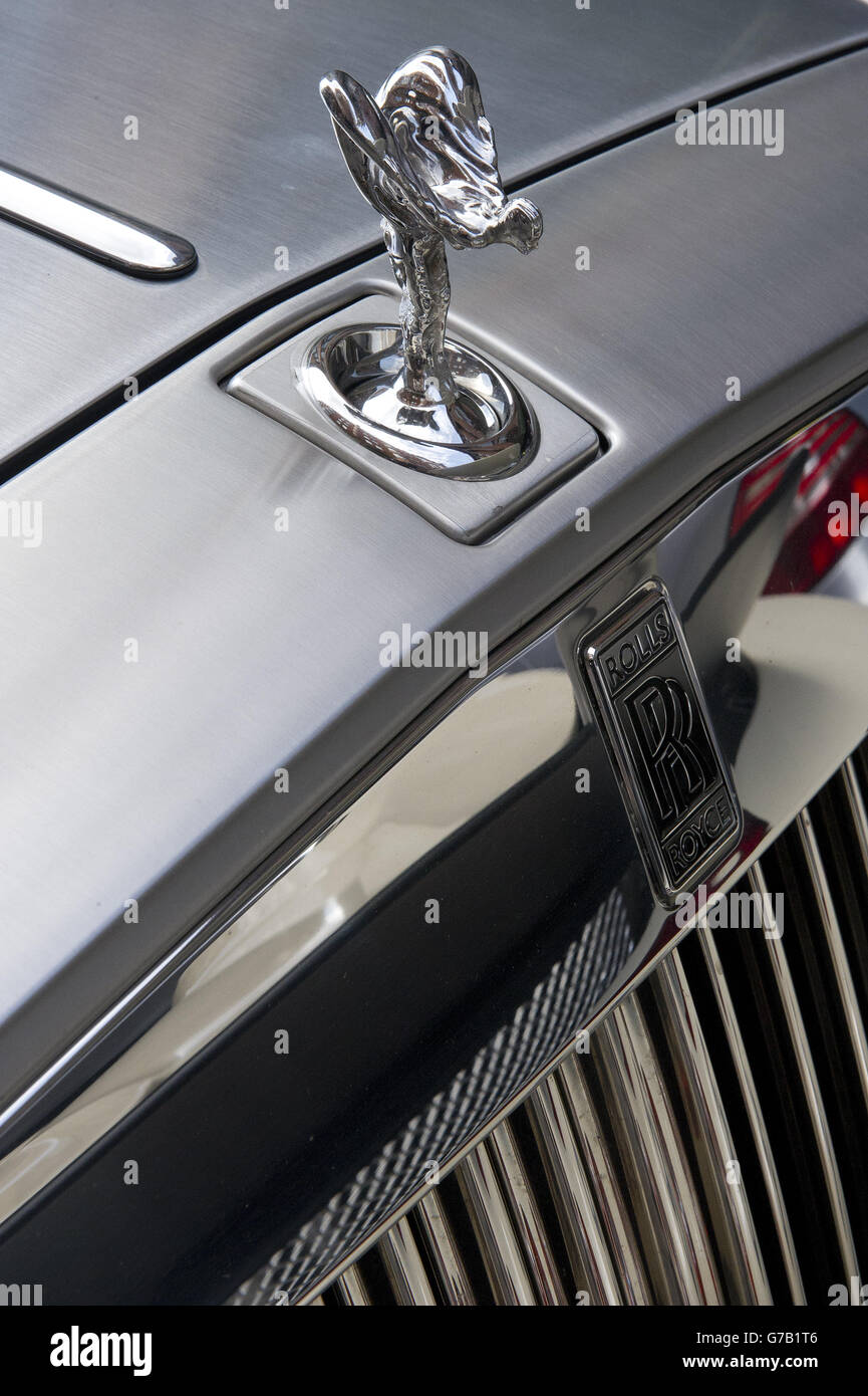 A Rolls Royce from the Middle East is parked outside Harrods in Knightsbridge, London. Stock Photo