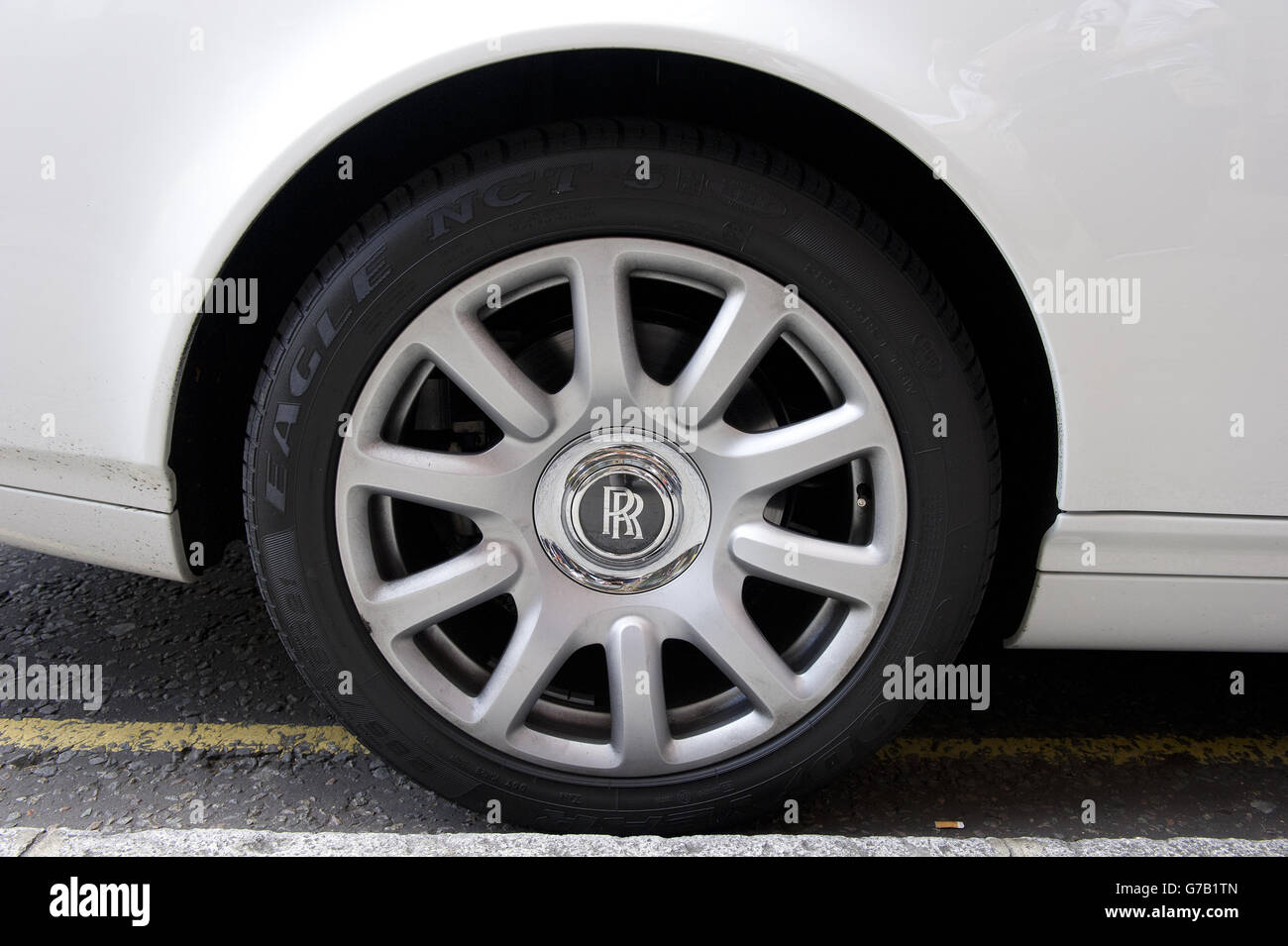 A Rolls Royce from the Middle East is parked outside Harrods in Knightsbridge, London. Stock Photo