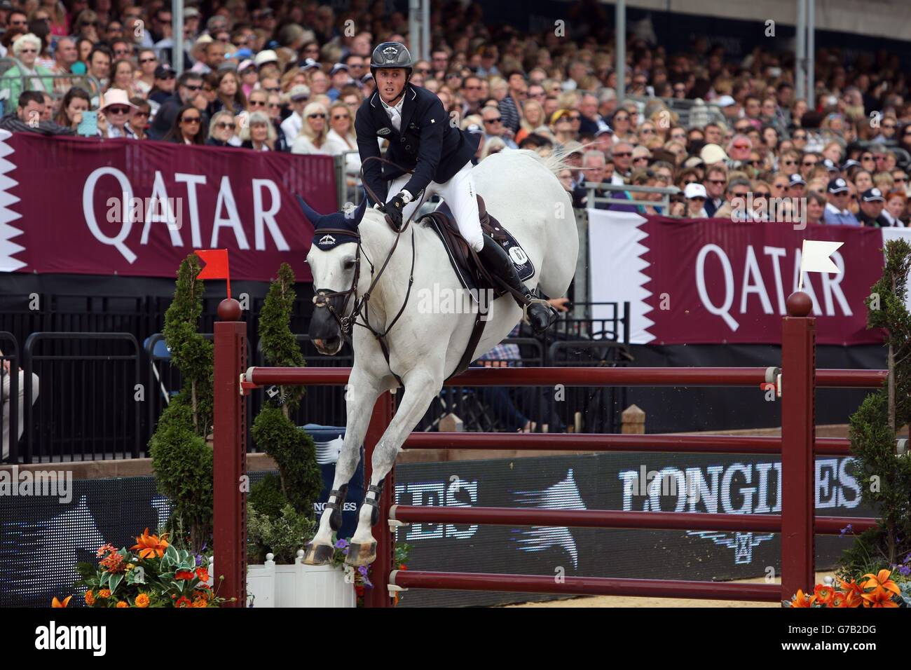 Great Britain's Ben Maher riding Cella competes in the Longines Global Champions Tour of London Grand Prix presented by Qatar during day three of the 2014 Longines Global Champions Tour at Horse Guards Parade Ground, London. Stock Photo