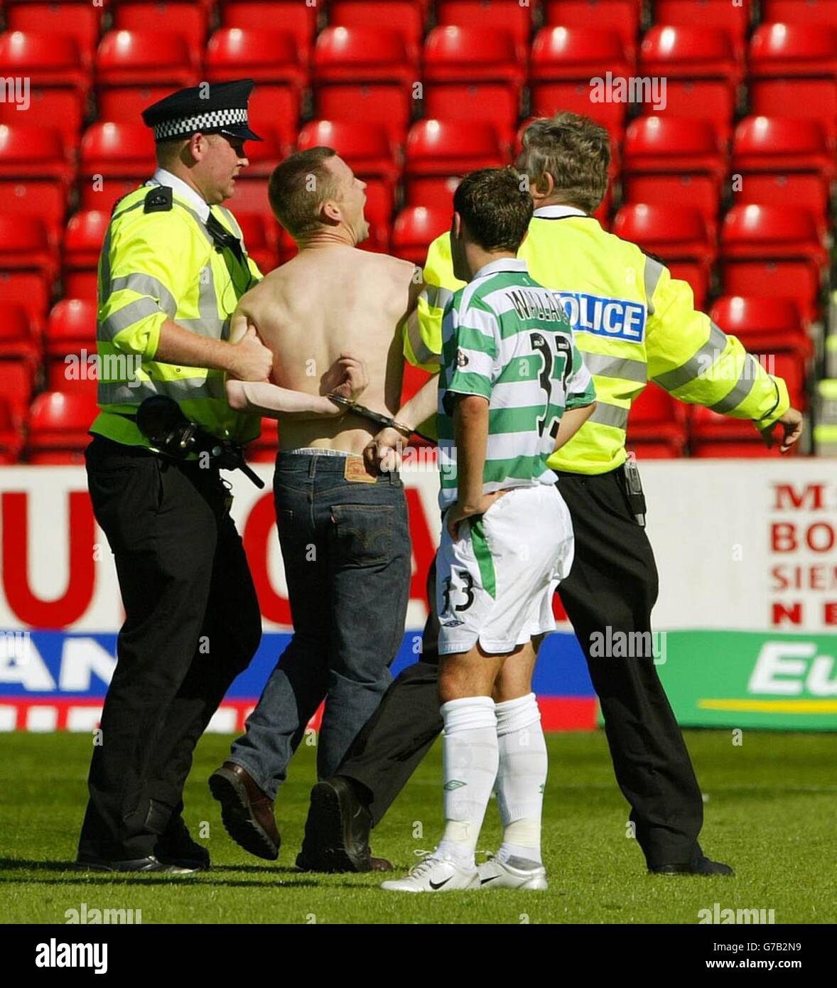 grampian-police-arrest-a-pitch-invader-as-celtics-ross-wallace-looks-G7B2N9.jpg