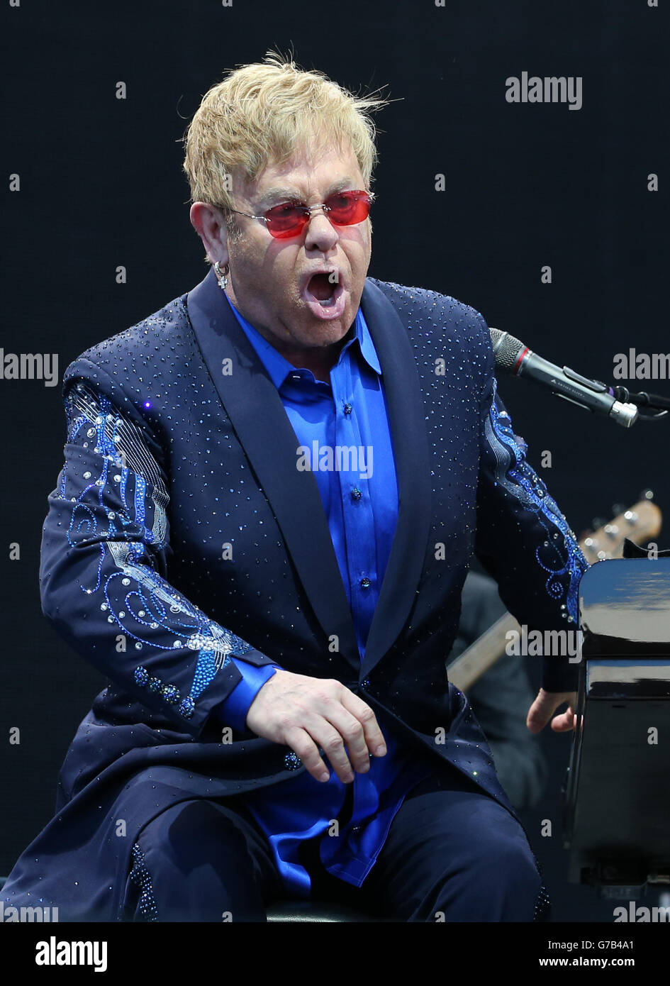 EDITORIAL USE ONLY Elton John performing on stage in a special open air
