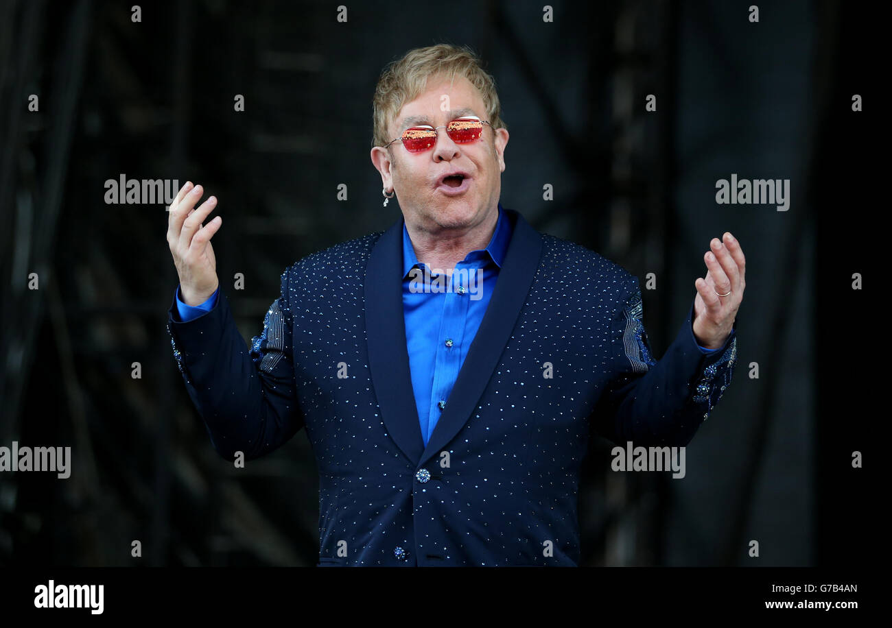 EDITORIAL USE ONLY Elton John performing on stage in a special open air