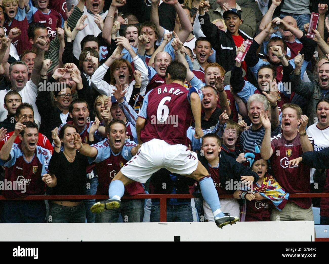Aston Villa's Gareth Barry celebrates his goal with fans in Holte End during game with Newcastle United during their Barclays Premiership match at Villa Park, Birmingham, Saturday August 28, 2004. Stock Photo