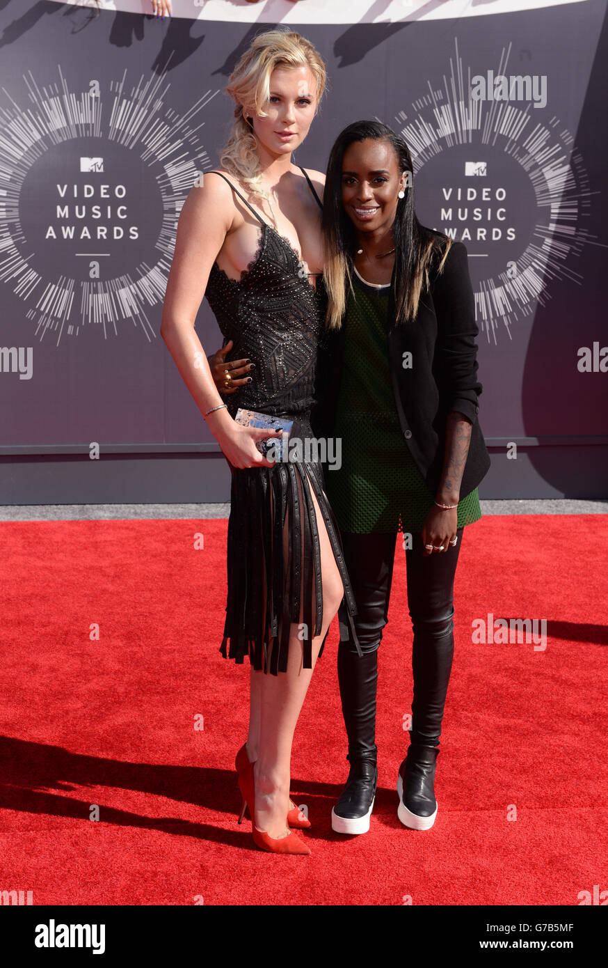 Ireland Baldwin and Angel Haze arriving at the MTV Video Music Awards 2014 at The Forum in Inglewood, Los Angeles. Stock Photo