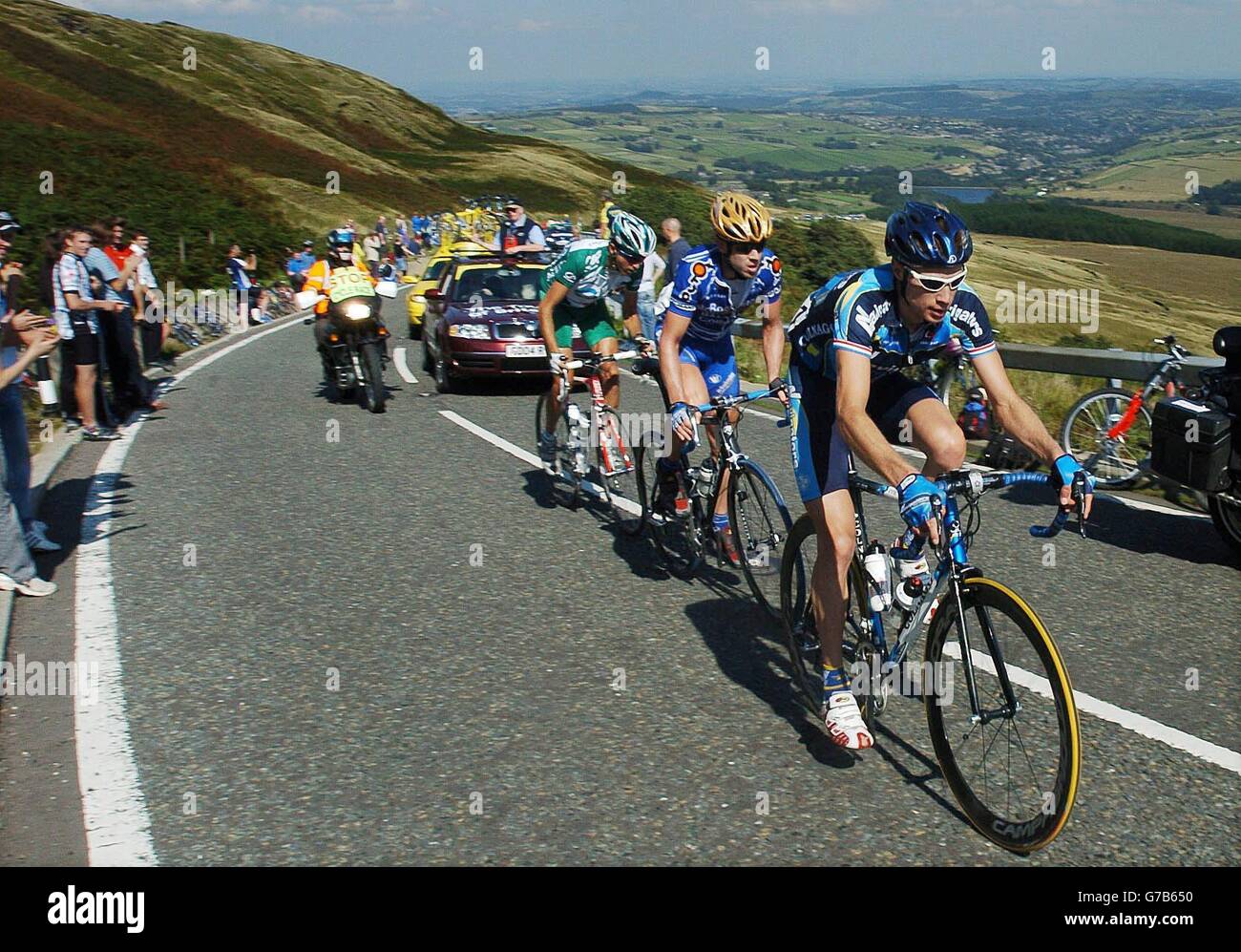Taking the lead in the Tour of Britain Cycle race a three man break away led by Chris Baldwin of the USA ahead of Ben Day of Australia, climb Holme Moss, near Holmfirth in the Peak District well ahead of the main bunch. Stock Photo
