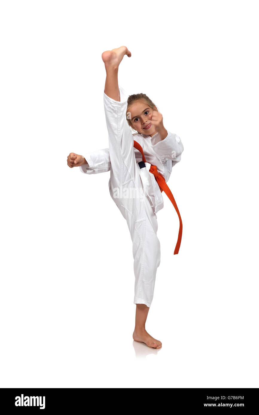 Little girl practice karate on a white background Stock Photo