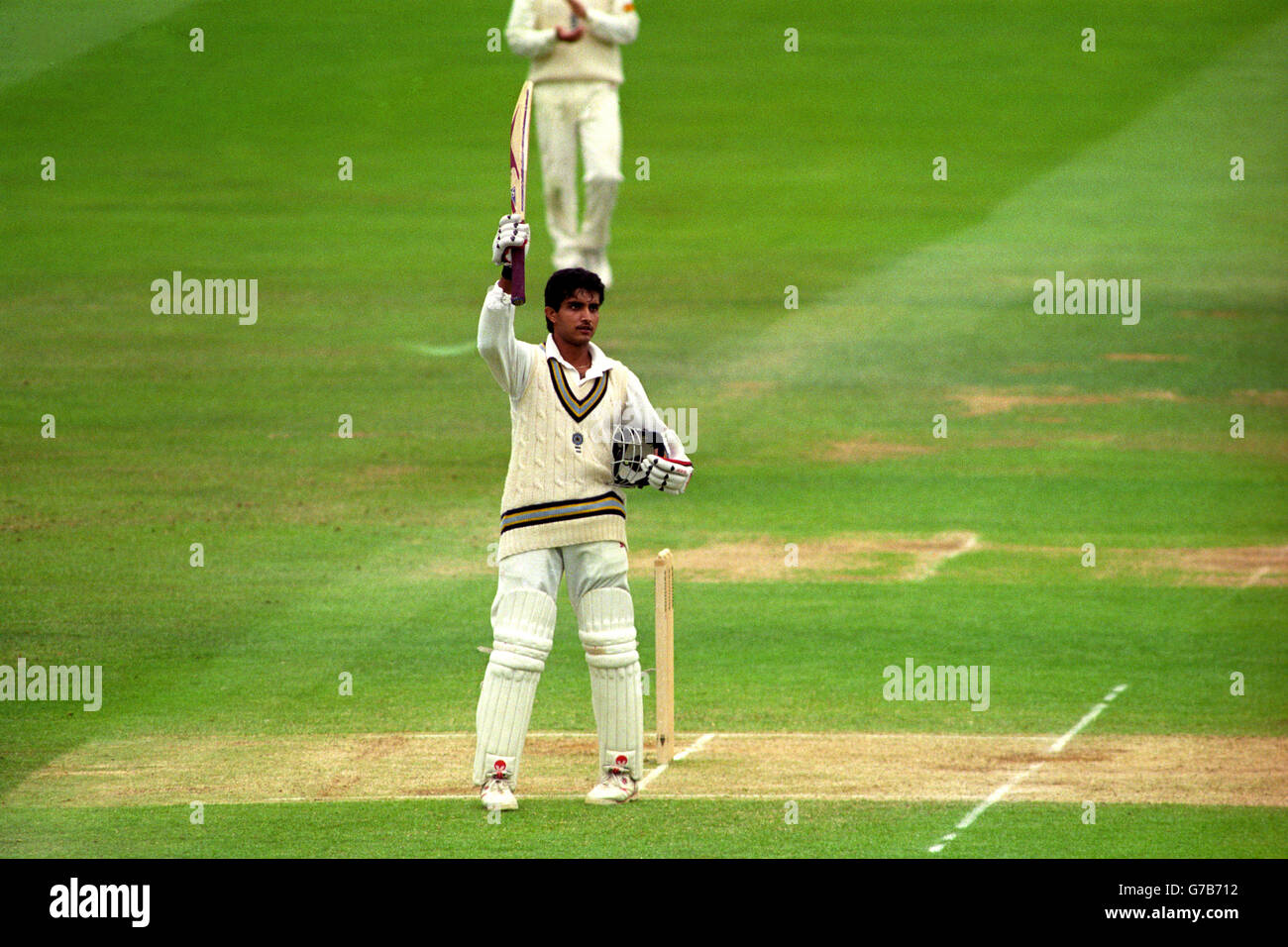 India's Saurav Ganguly acknowledges the crowd after completing his maiden Test century during play at Lord's. Stock Photo