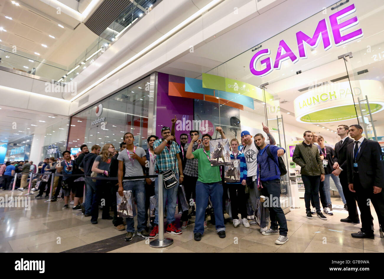 Left to right: Andre Toth, 15 and Csaba Toth, 38 from Wood Green North London are the first people to pick up Destiny, the latest game from the creators of Halo, after its midnight release at GAME in Westfield Stratford City in London. PRESS ASSOCIATION Picture date: Monday September 8, 2014. Photo credit should read: Matt Alexander/PA Stock Photo