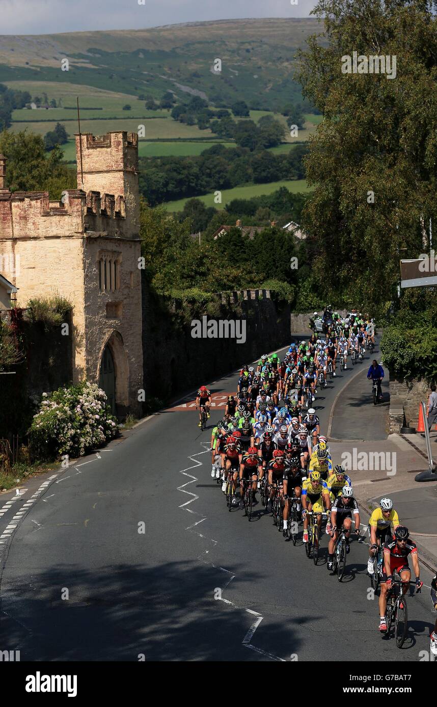 The Peloton rides through the town of Crickhowell in Wales during the stage three of the 2014 Tour of Britain. Stock Photo