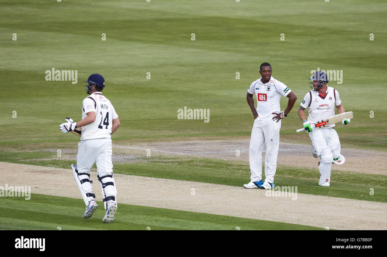 Luke Proctor Text Lancashire's Tom Smith (24) and Luke Proctor pass Sussex's Chris Jordan ...