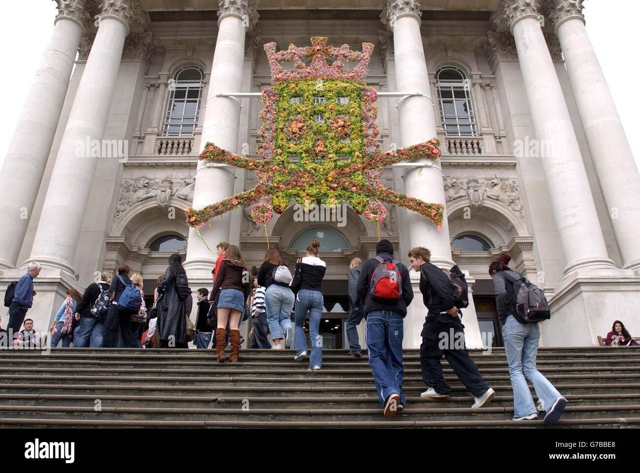 Hew Locke's new work 'King Creole' on the front of Tate Britain in central London. Locke describes the piece as a 'voo-doo-esque' version of Augustus Pugin's House of Commons coat of arms. Stock Photo