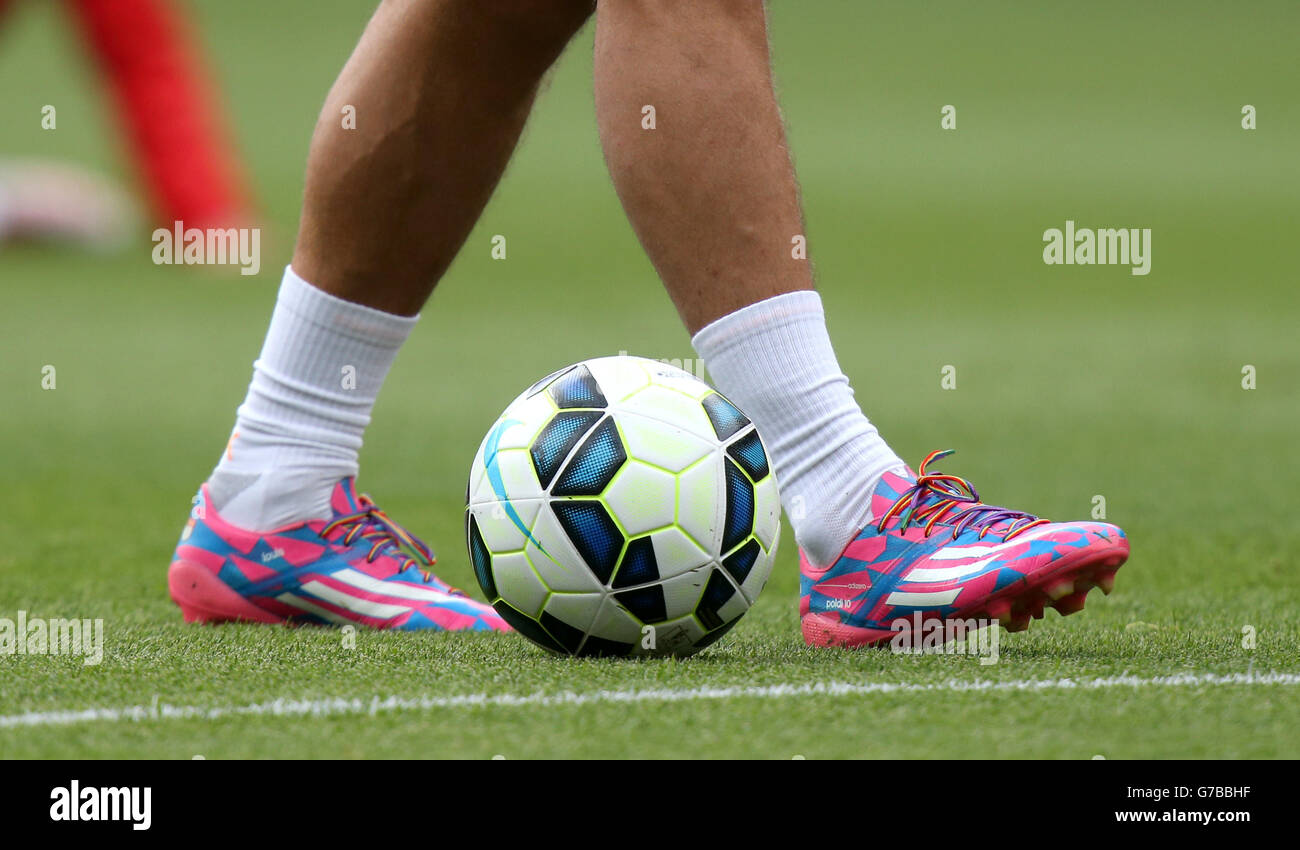 Soccer - Barclays Premier League - Arsenal v Manchester City - Emirates Stadium. Rainbow laces can be seen on the boots of Arsenal's Lukas Podolski during the warm up Stock Photo