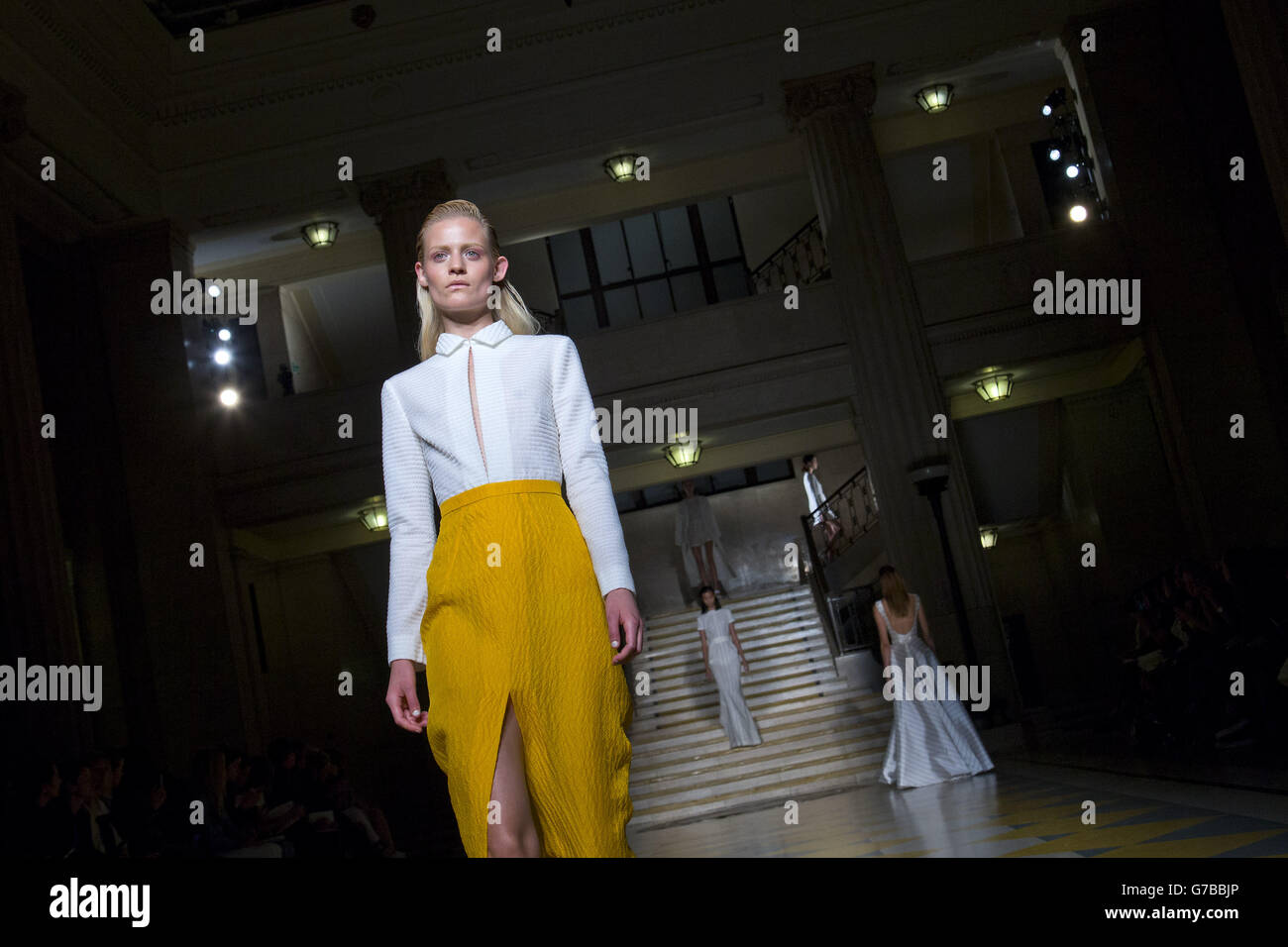 Models on the catwalk during the Emilia Wickstead catwalk show at The Banking Hall in London during London Fashion Week. Stock Photo