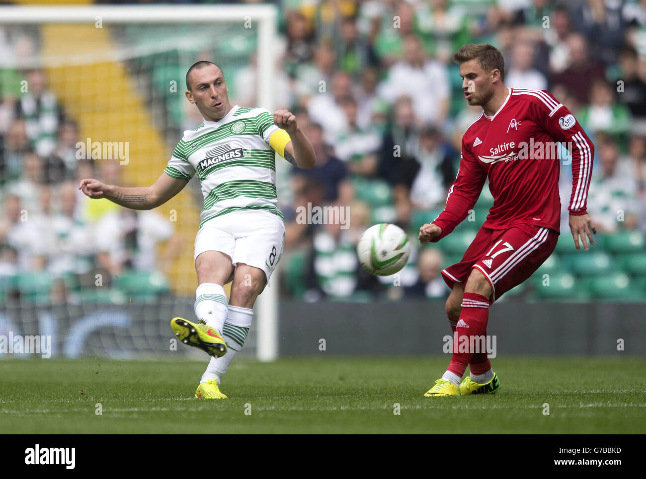 Celtic's Scott Brown (left) and Aberdeen David Goodwillie during the Scottish Premiership match at Celtic Park, Glasgow. Stock Photo