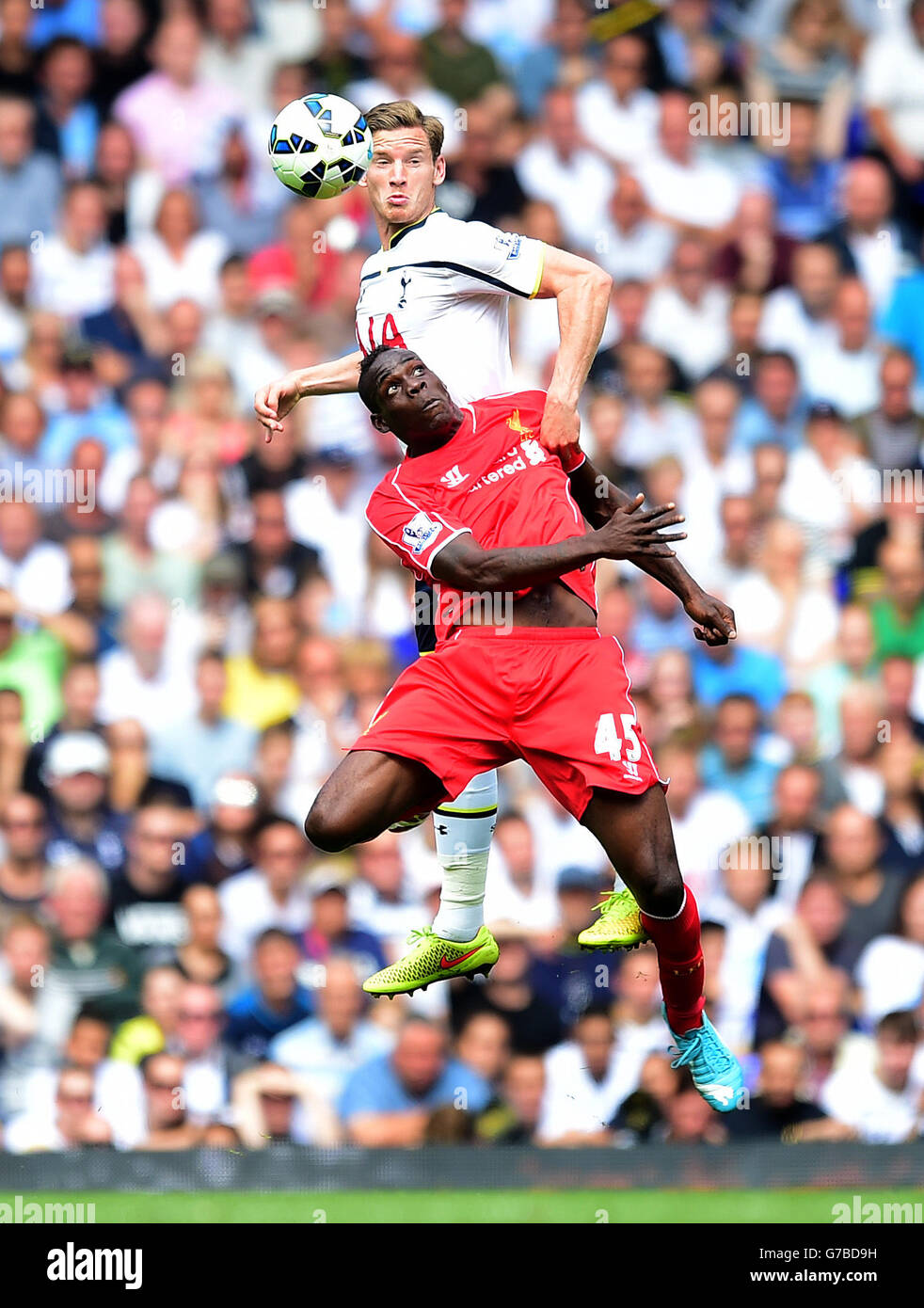 Tottenham Hotspur's Jan Vertongen (top) and Liverpool's Mario Balotelli battle for the ball in the air during the Barclays Premier League match at White Hart Lane, London. PRESS ASSOCIATION Photo. Picture date: Sunday August 31, 2014. See PA story SOCCER Tottenham. Photo credit should read: Adam Davy/PA Wire. Stock Photo