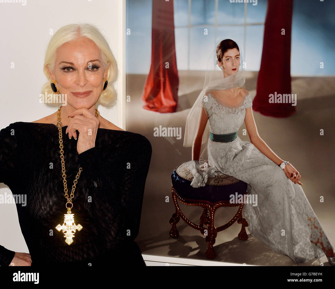 83 year old Carmen Dell' Orefice, who is often cited as the world's oldest model, next to portrait of her taken by Horst P Horst in 1947 when she was fifteen, at a photocall to launch an exhibition by the celebrated Vogue magazine fashion photographer at the Victorian & Albert Museum in central London. Stock Photo