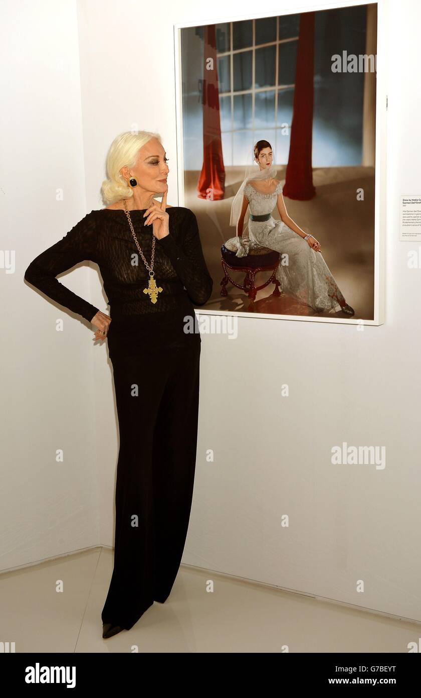 83 year old Carmen Dell' Orefice, who is often cited as the world's oldest model, next to portrait of her taken by Horst P Horst in 1947 when she was fifteen, at a photocall to launch an exhibition by the celebrated Vogue magazine fashion photographer at the Victorian &amp; Albert Museum in central London. Stock Photo