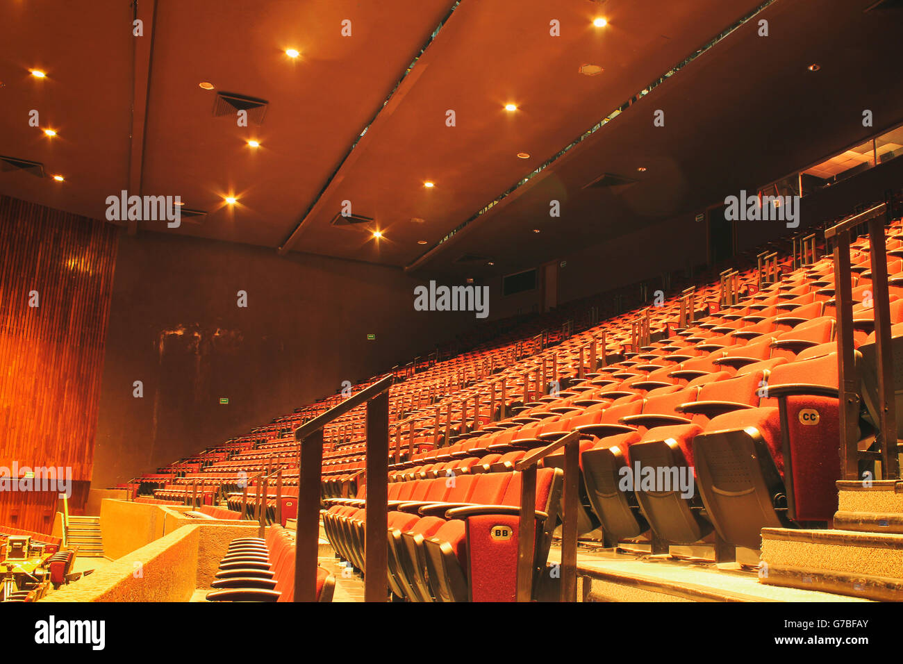 Photograph of an empty theater with red seats Stock Photo